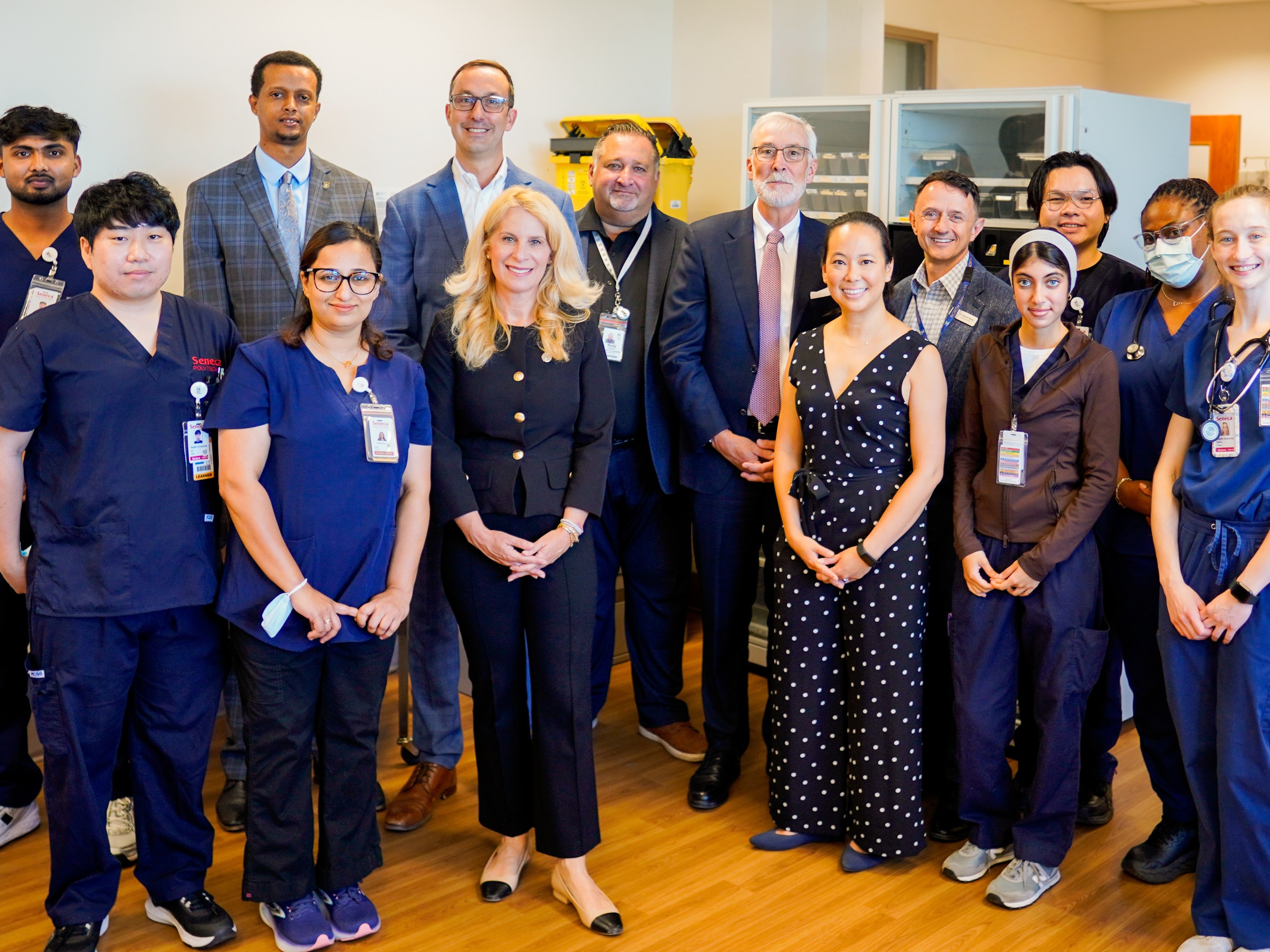 Minister Nolan Quinn observes Seneca nursing students learning on the front lines