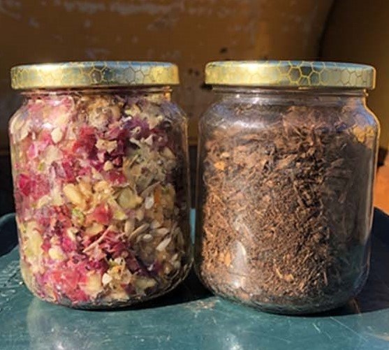 The image shows two jars; the one on the left shows the food waste before it is processed on the rocket, which has red and yellow colours, and the one on the right is brown compost.