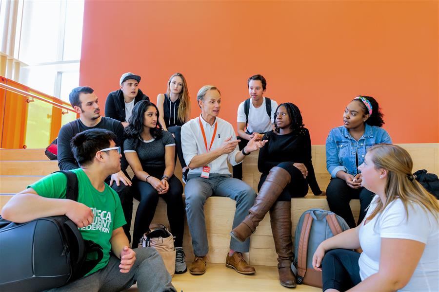 Students sitting in a group listening to professor