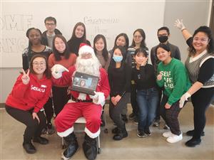 Pictures with Santa! Hybrid event so our staff is also shown on the iPad (Hi Sophie!).